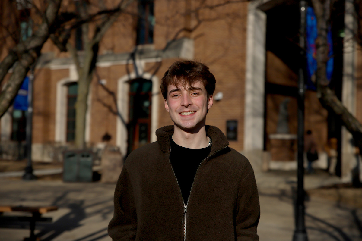 Beau Rass in front of DePaul library