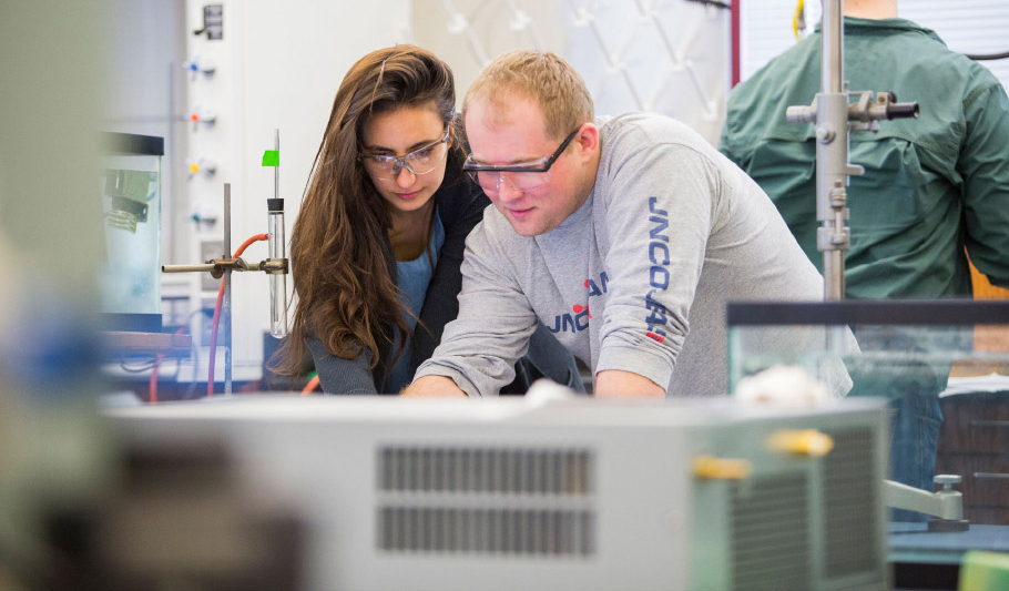 Two students working together in a classroom lab.