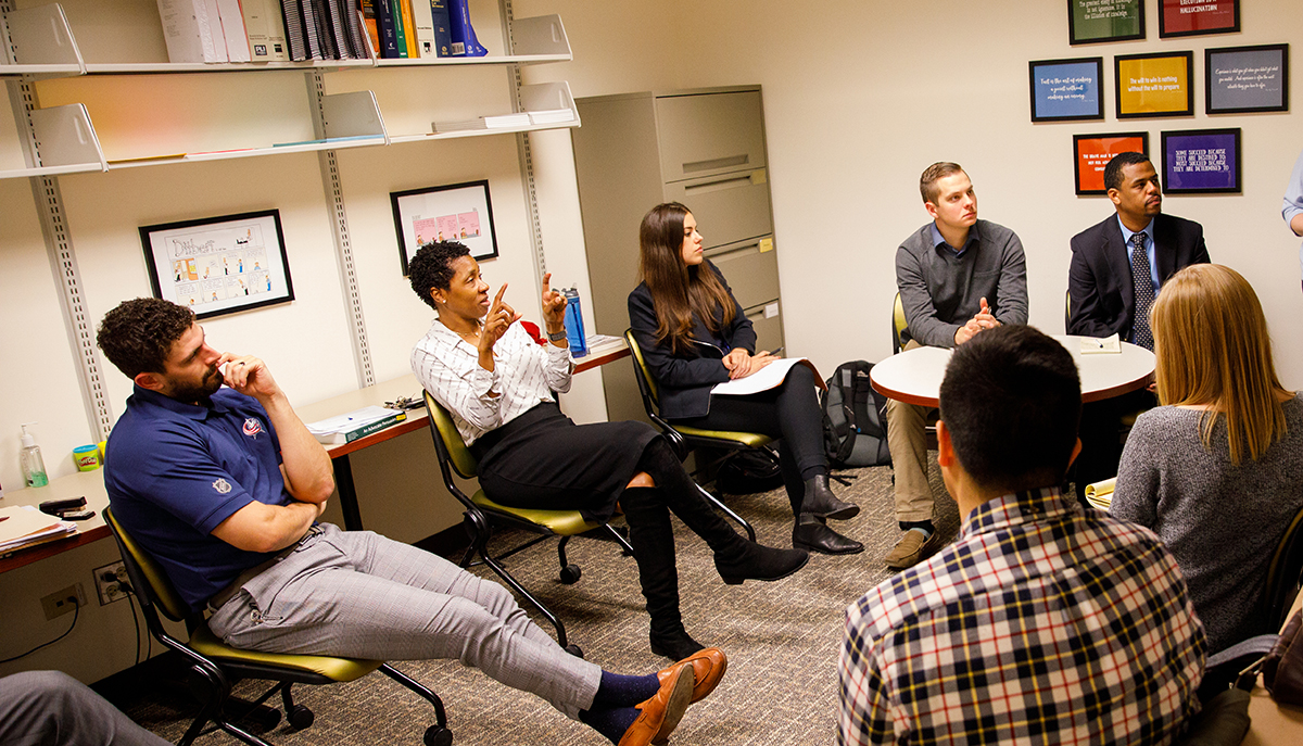 Julie Lawton speaking to some students