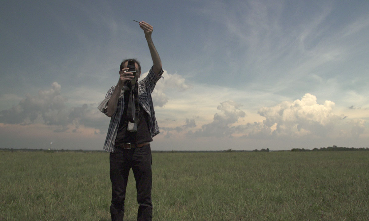 man photographing outside