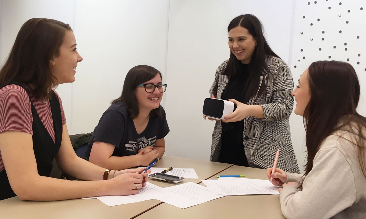 group of ladies with a VR set