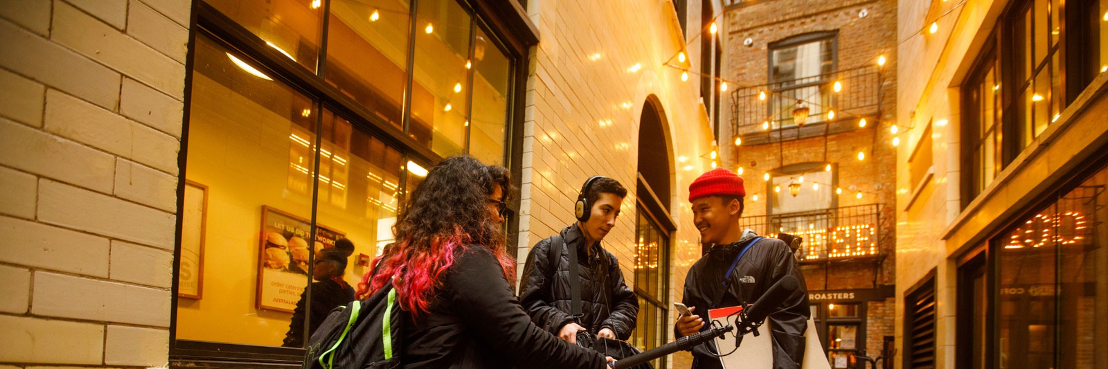 Three students conducting an interview