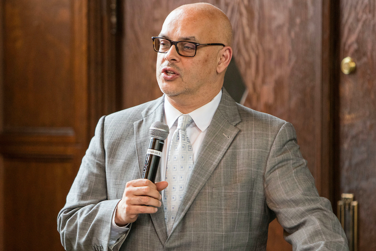 José Perales presents to an audience