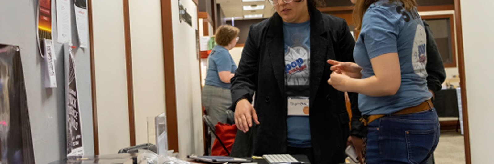 DePaul Pop Culture Conference attendees look over items for sale