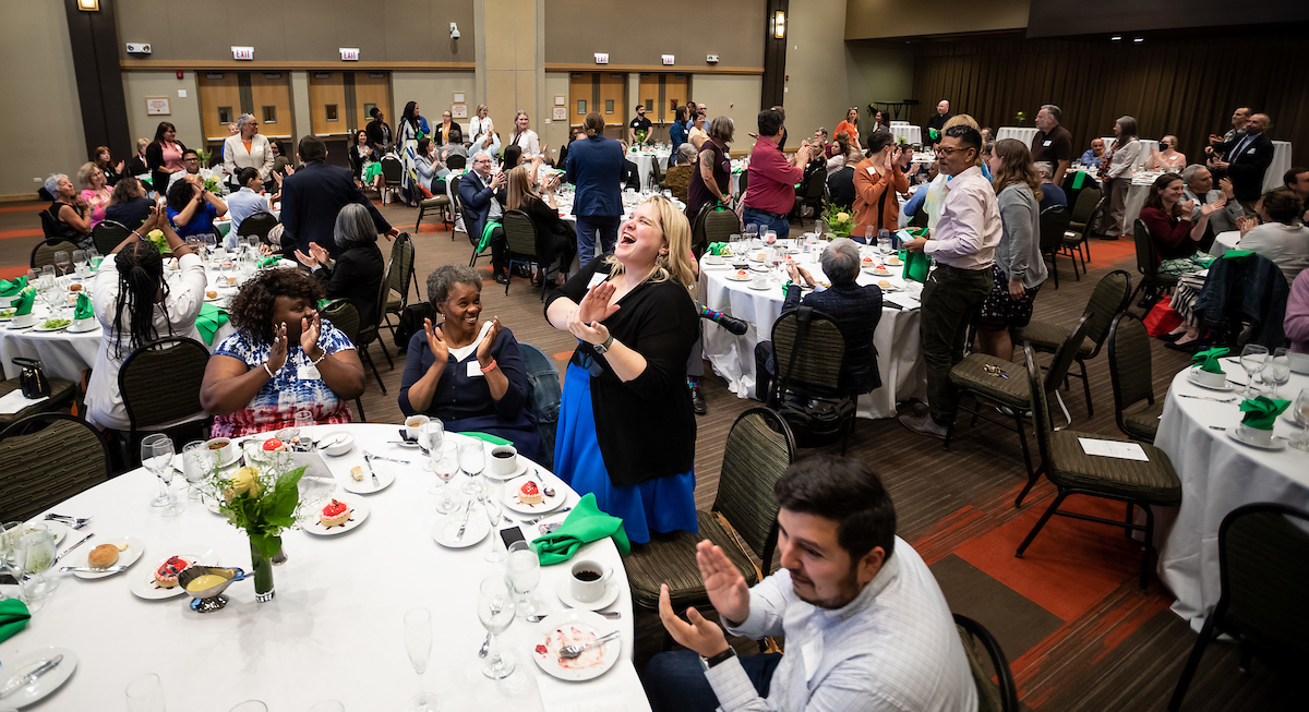 Honorees stand to be recognized for their years of service during the 33rd annual Distinguished Service Awards luncheon.