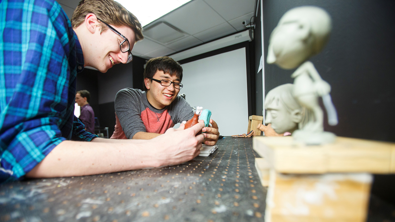 Animation students working with models