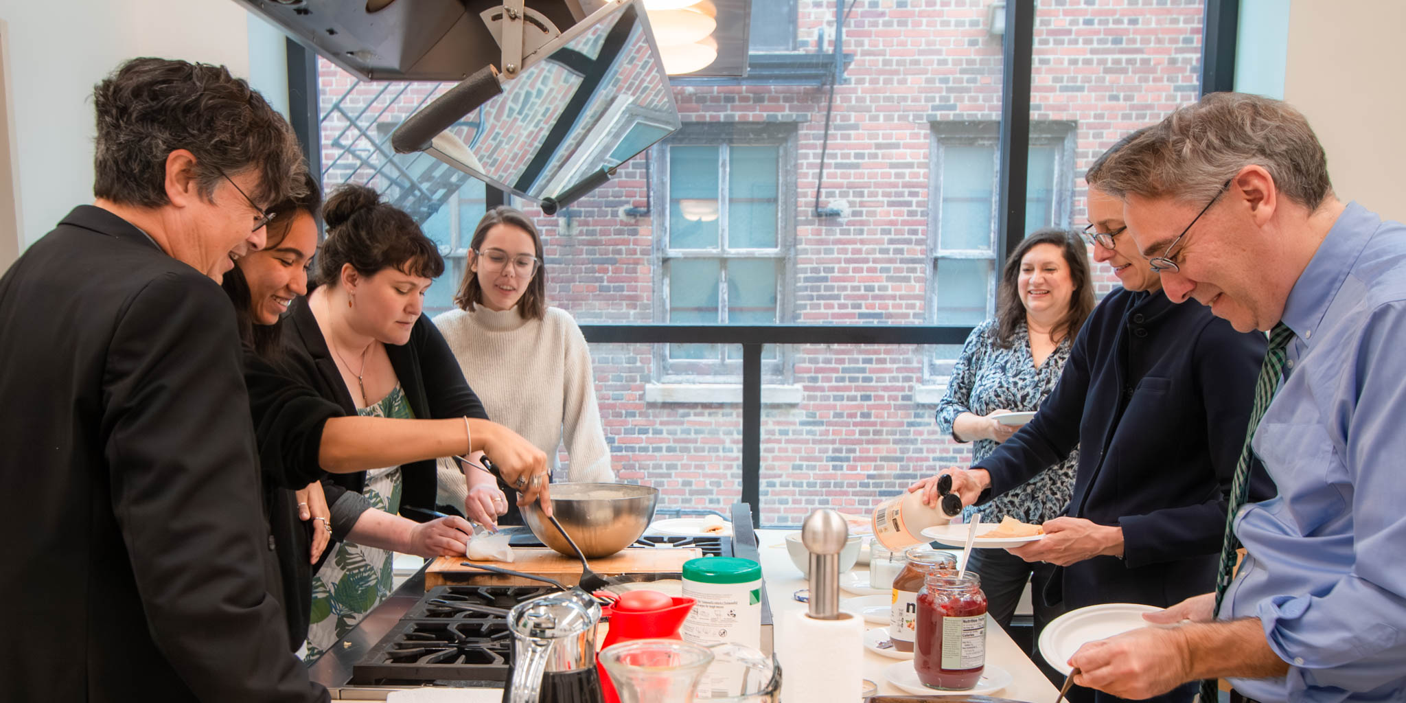 Faculty Fellows making crepes during visit to Alliance Française de Chicago