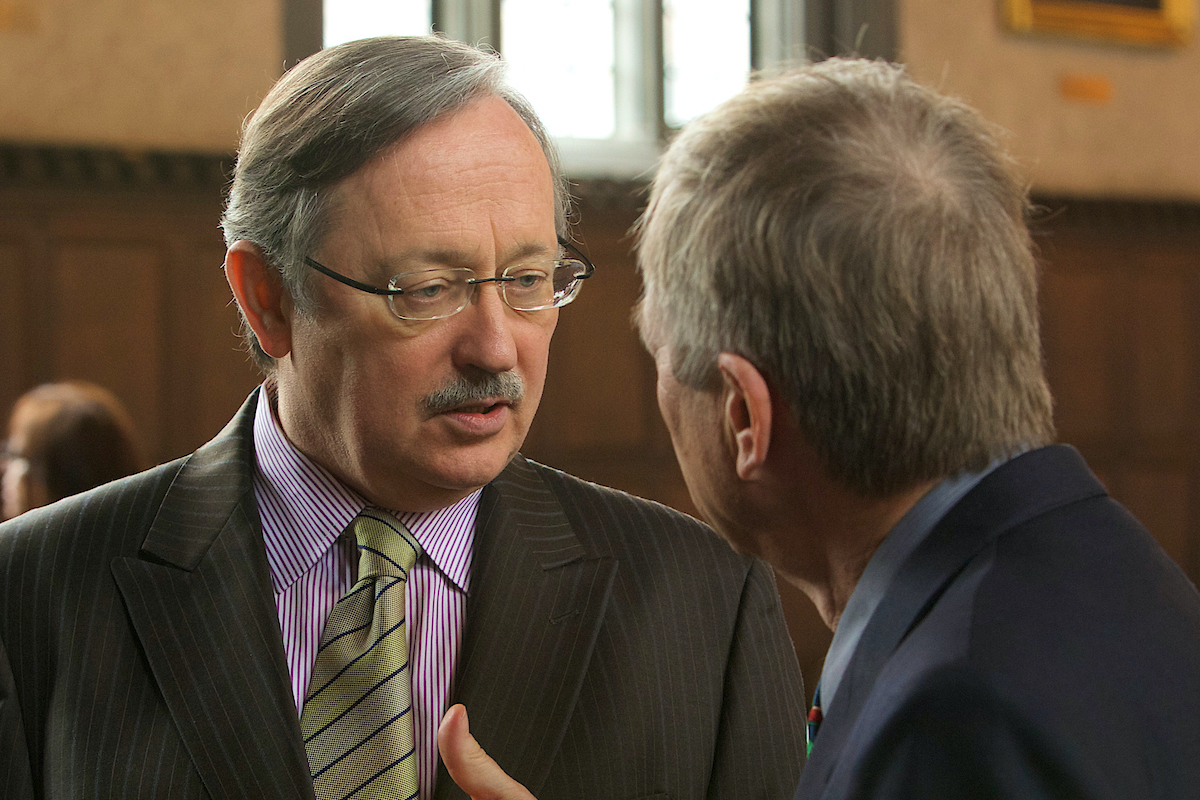 J.D. Bindenagel talks with another man