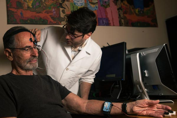 Psychological science student in eye tracker lab.