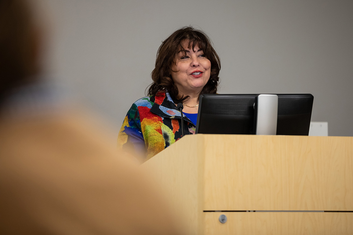 Liz Ortiz speaks at the President's book club.