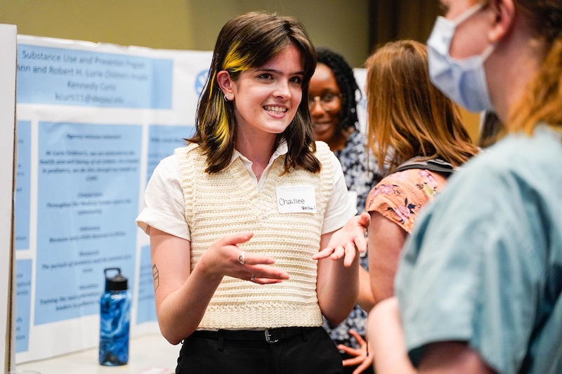 Woman speaking and gesturing