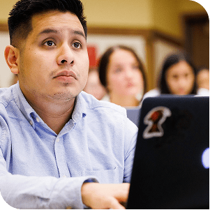 Male DePaul Law student in class