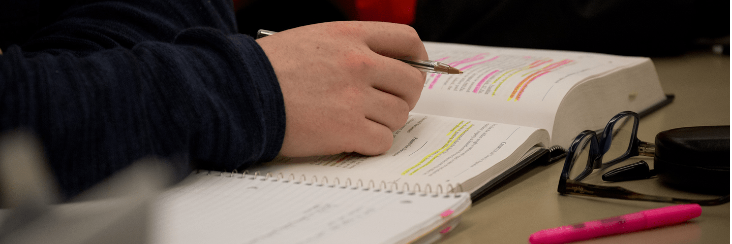 Student With Highlighted Book