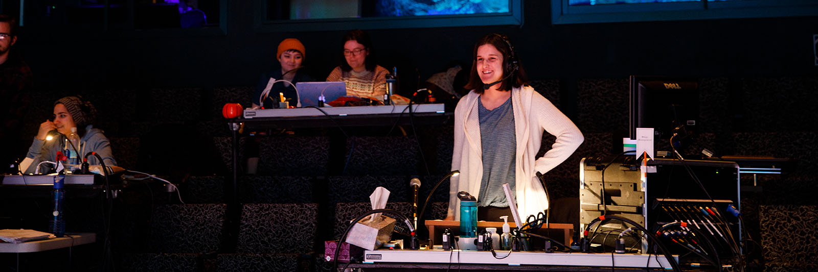 A stage management major works in the Watts Theatre