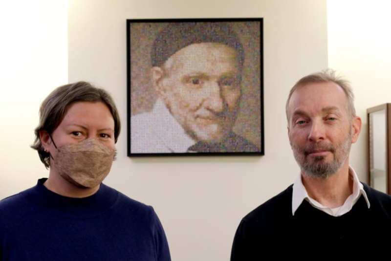Robin Hoecker and Jay Baglia in front of Vincent DePaul Mosaic