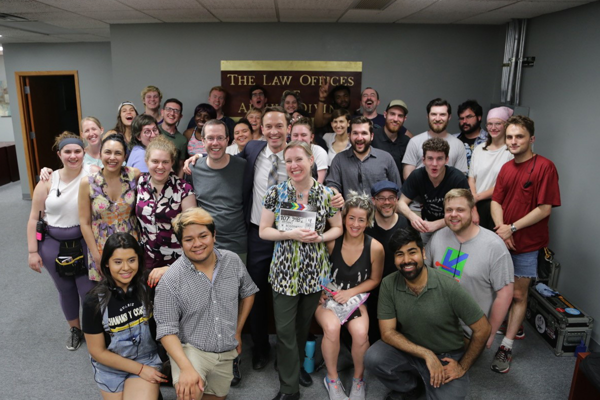 Inferno crew poses in a law office