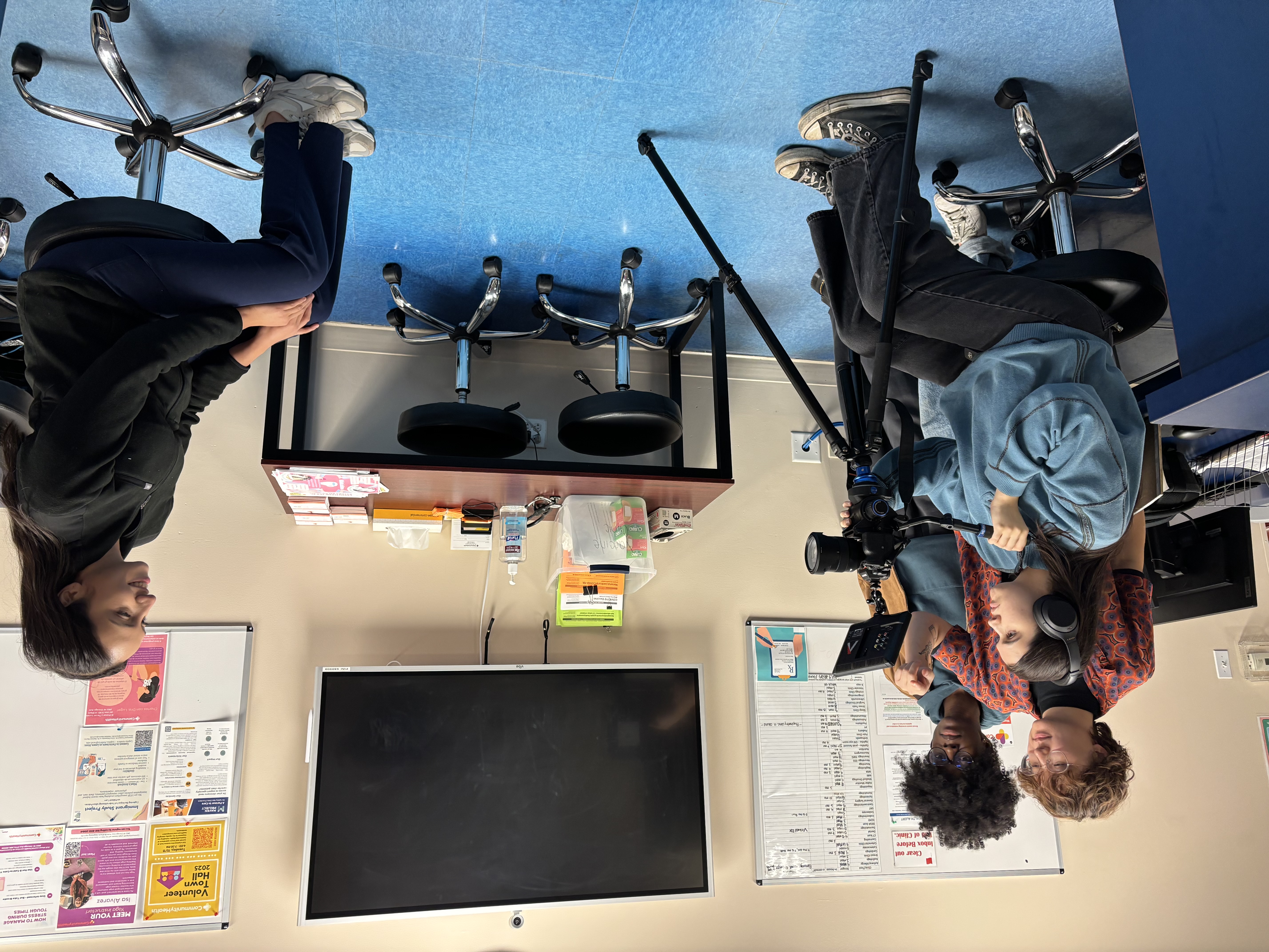 Sofia Santos recording a CommunityHealth volunteer with Alice Woo and Miriam Amoako-Kankam behind the camera