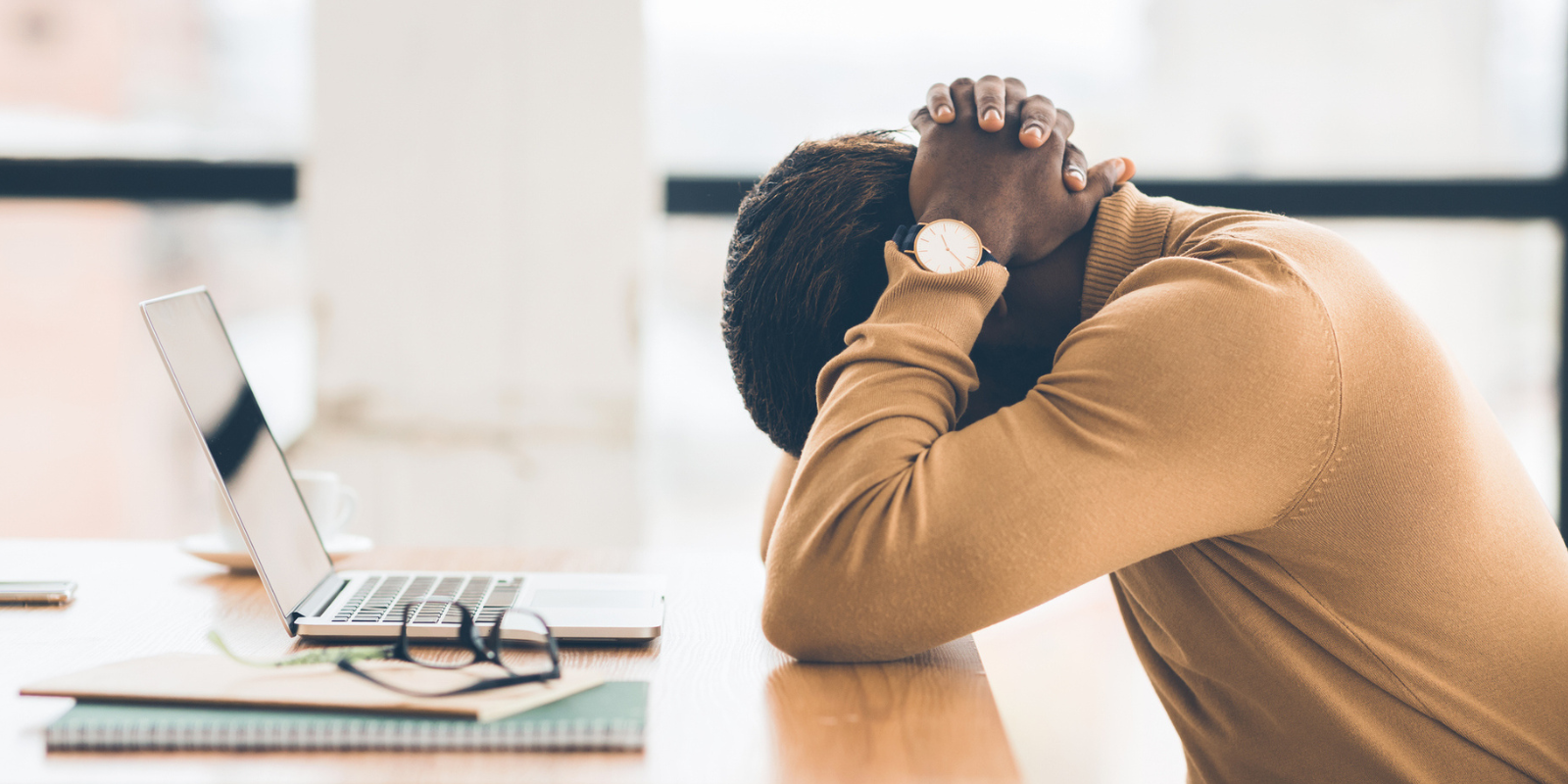 man sitting in front of his laptop