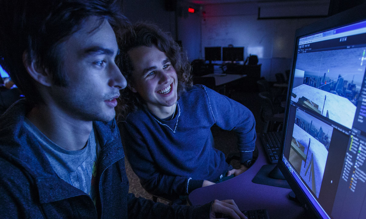 students reviewing game design