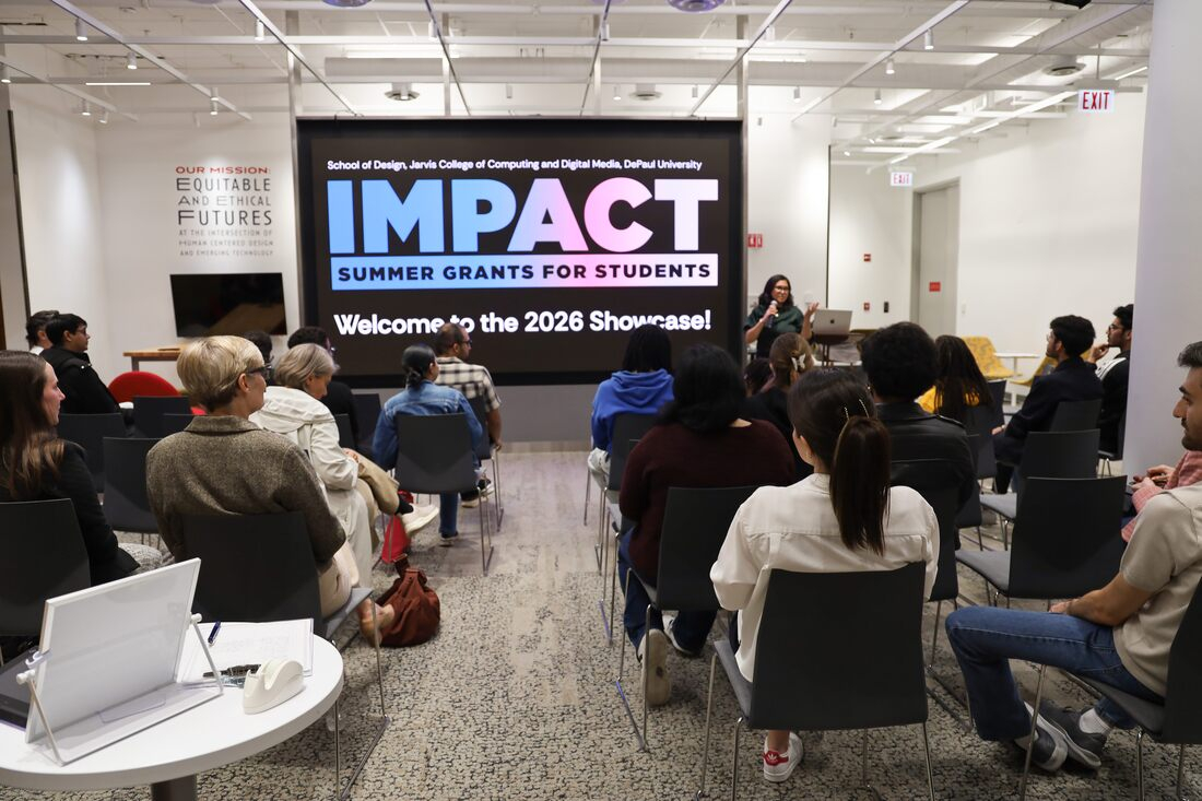 Large screen that says "Impact Summer Grants for Students. Welcome to the 2026 Showcase!" in a full room with a presenter up front