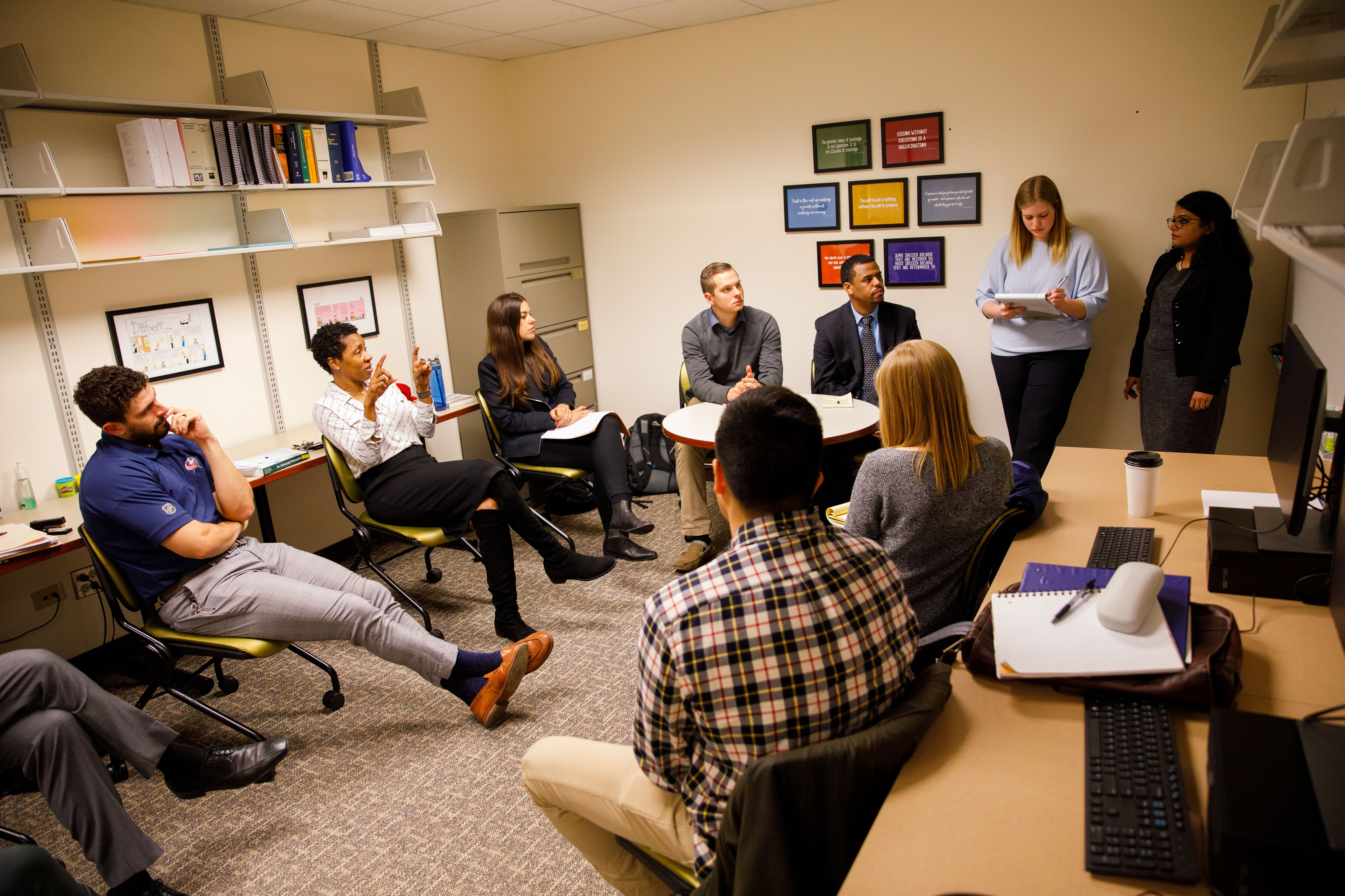 A photo of 10 people at a business law clinic meeting from 2019
