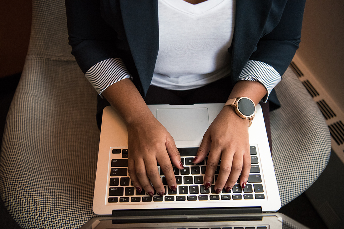 Person typing on laptop