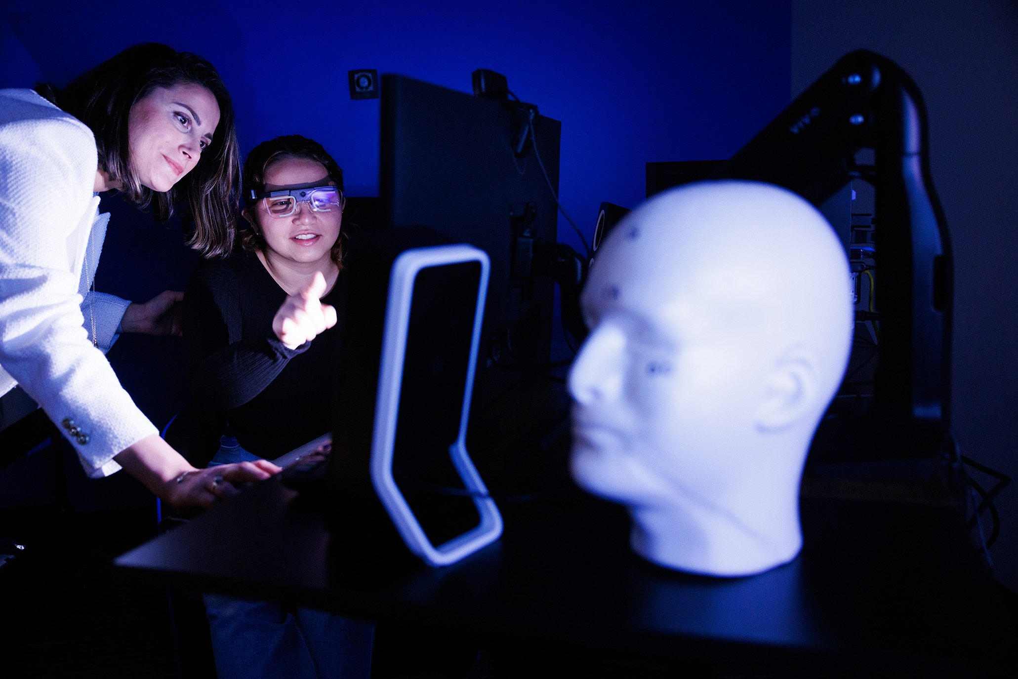 Student and faculty member interacting in the lab