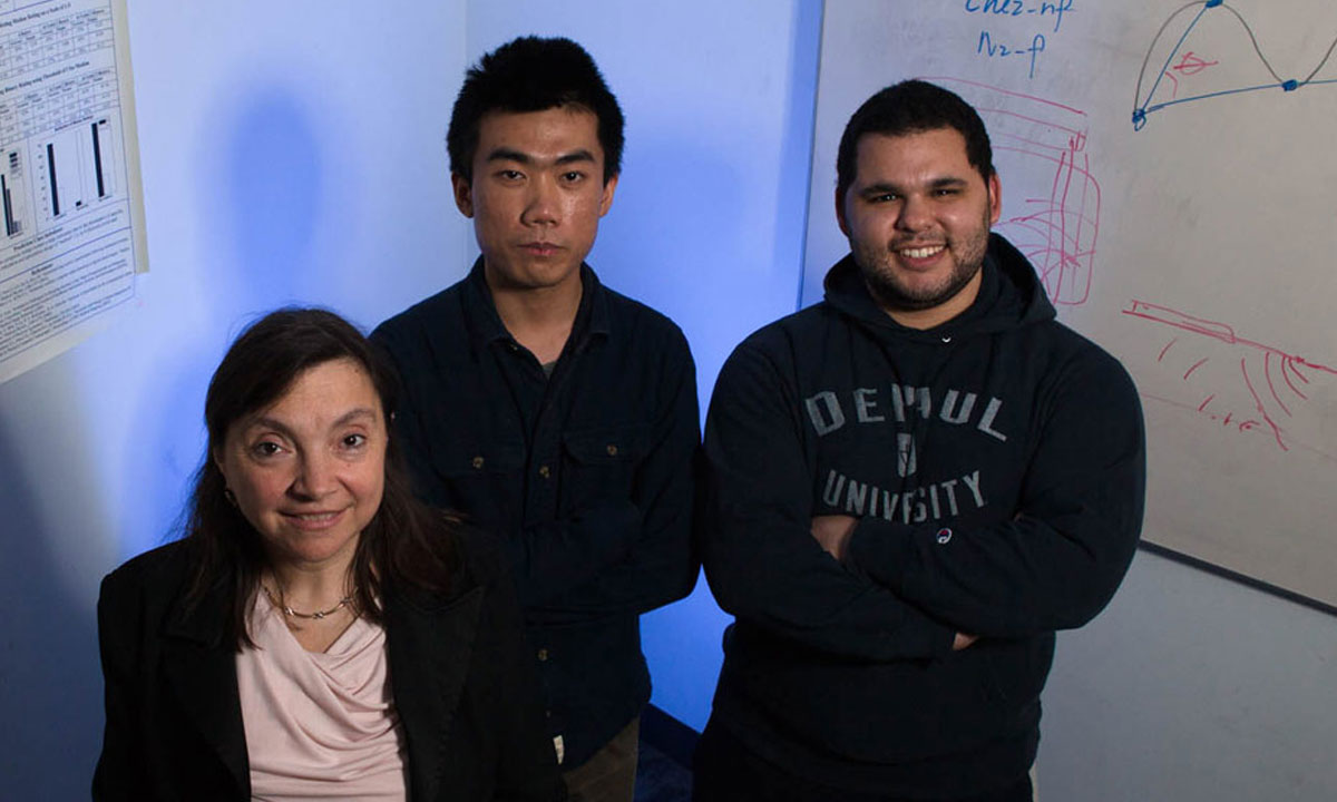 faculty member with two students