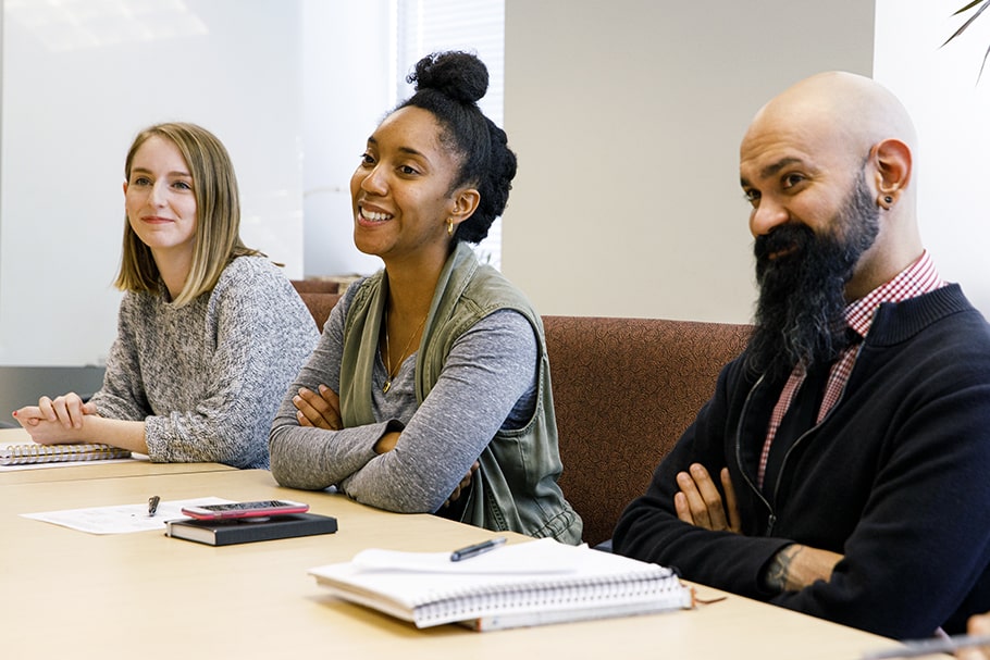 Students seated at a conference table