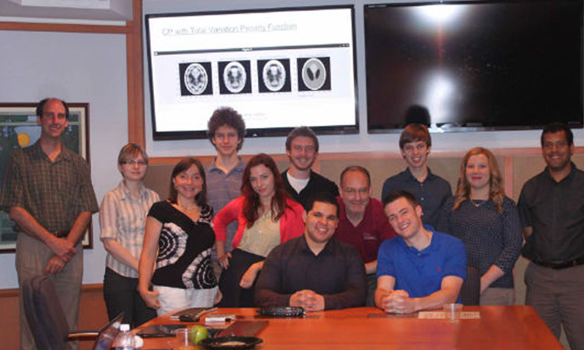 group photo of a dozen faculty and students