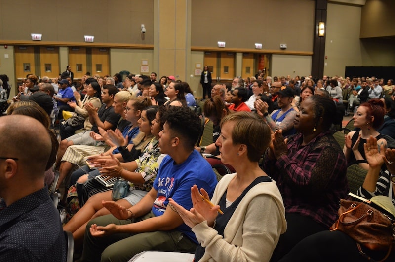 Audience applauding at lecture
