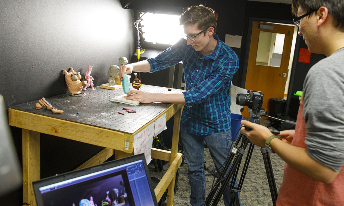 student working with clay for character animation