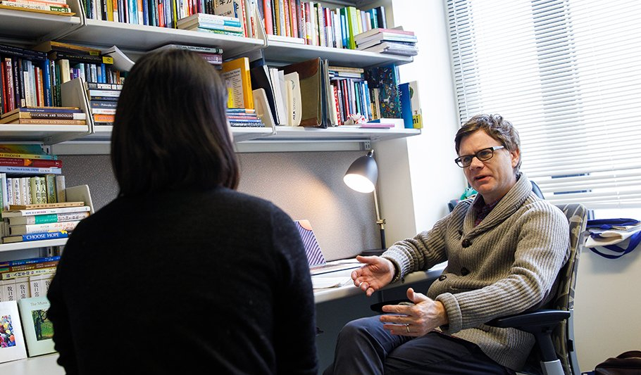 People conversing in counselor office