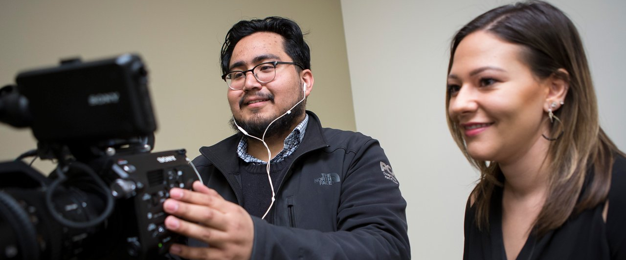 Two students operating a video camera