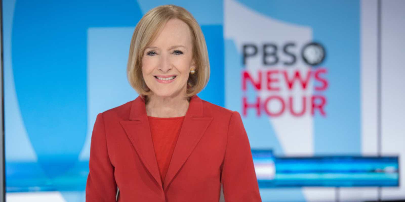 Judy Woodruff sits at anchor desk