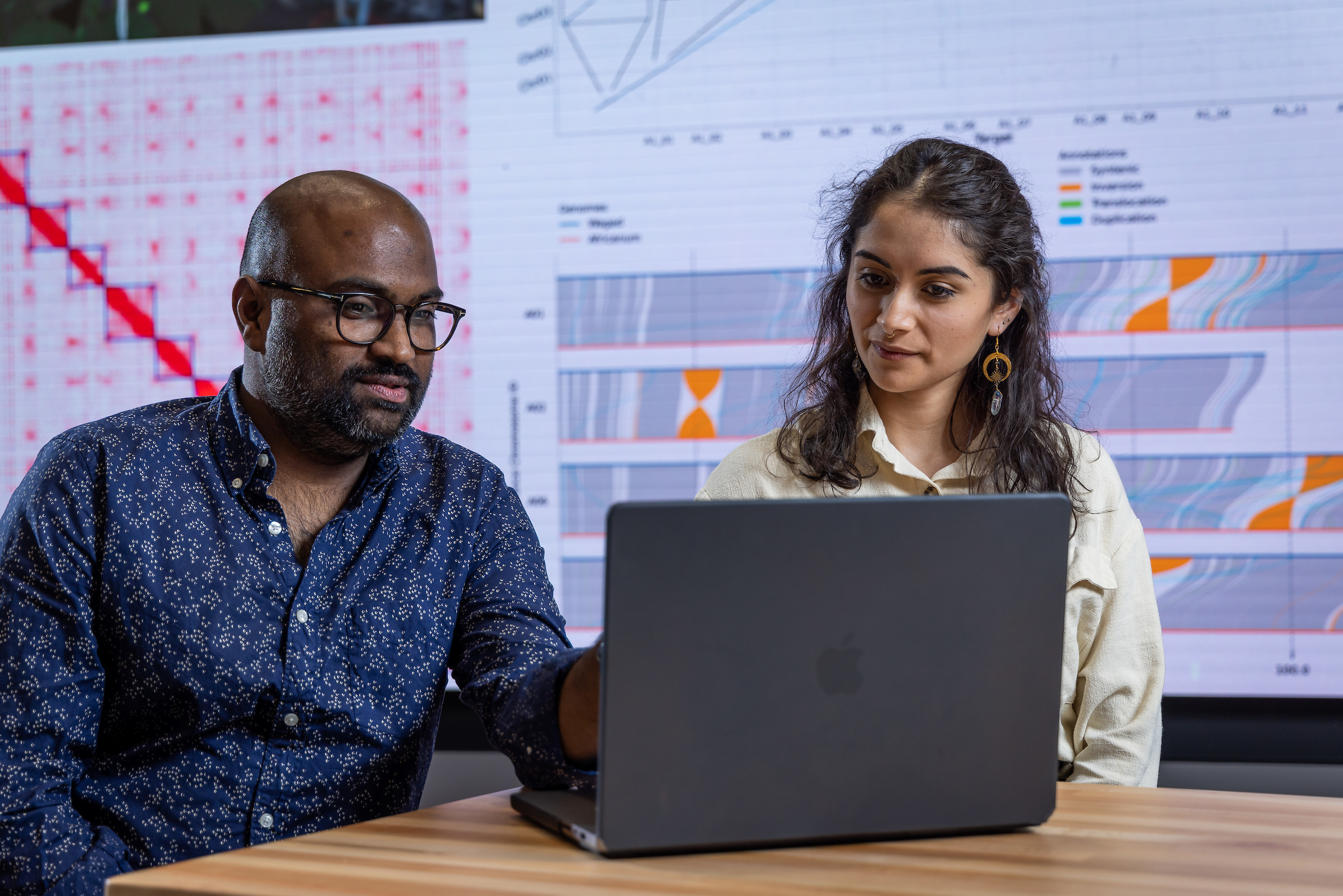 Thiru Ramaraj and Azalea Mendoza at a laptop
