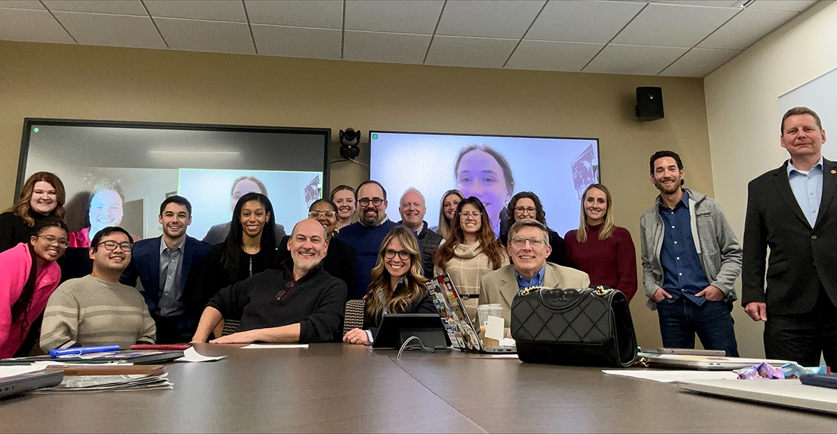 Students, judges and Professor Matt Ragas pose for a group photo