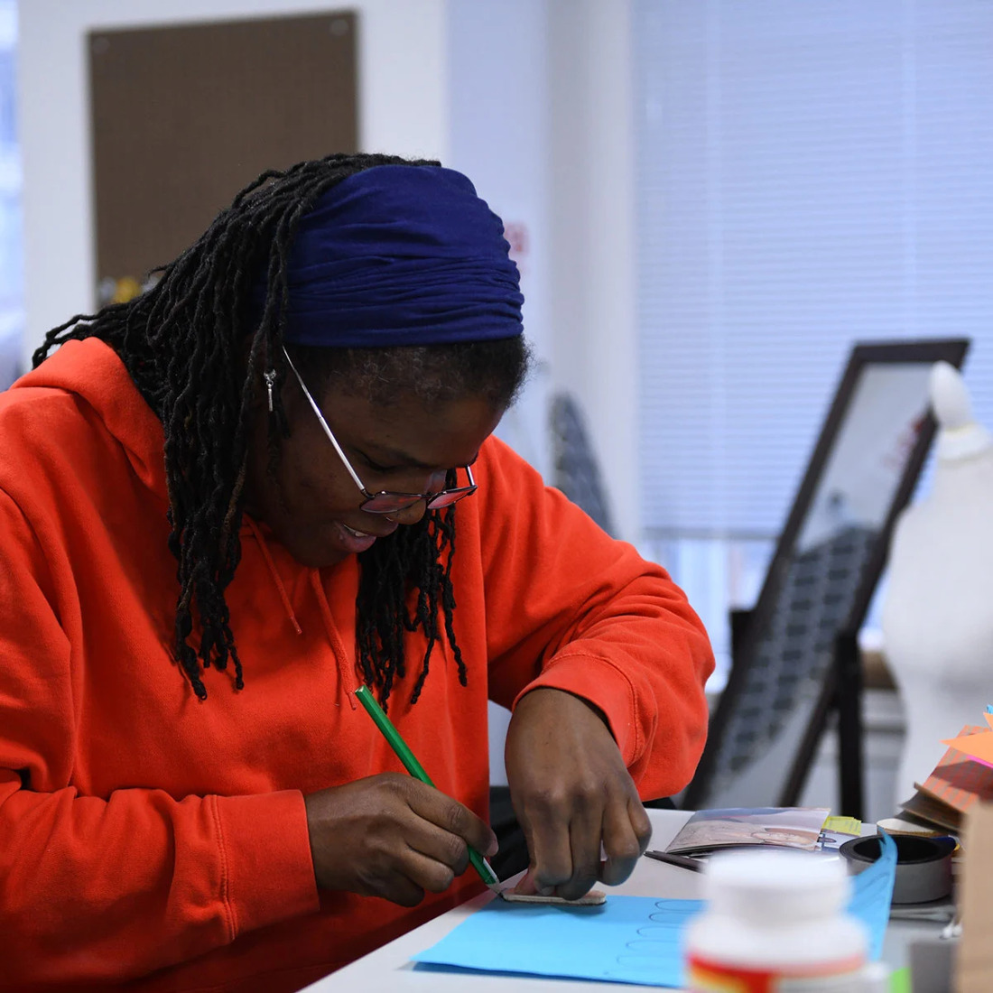 Design student trimming their creation