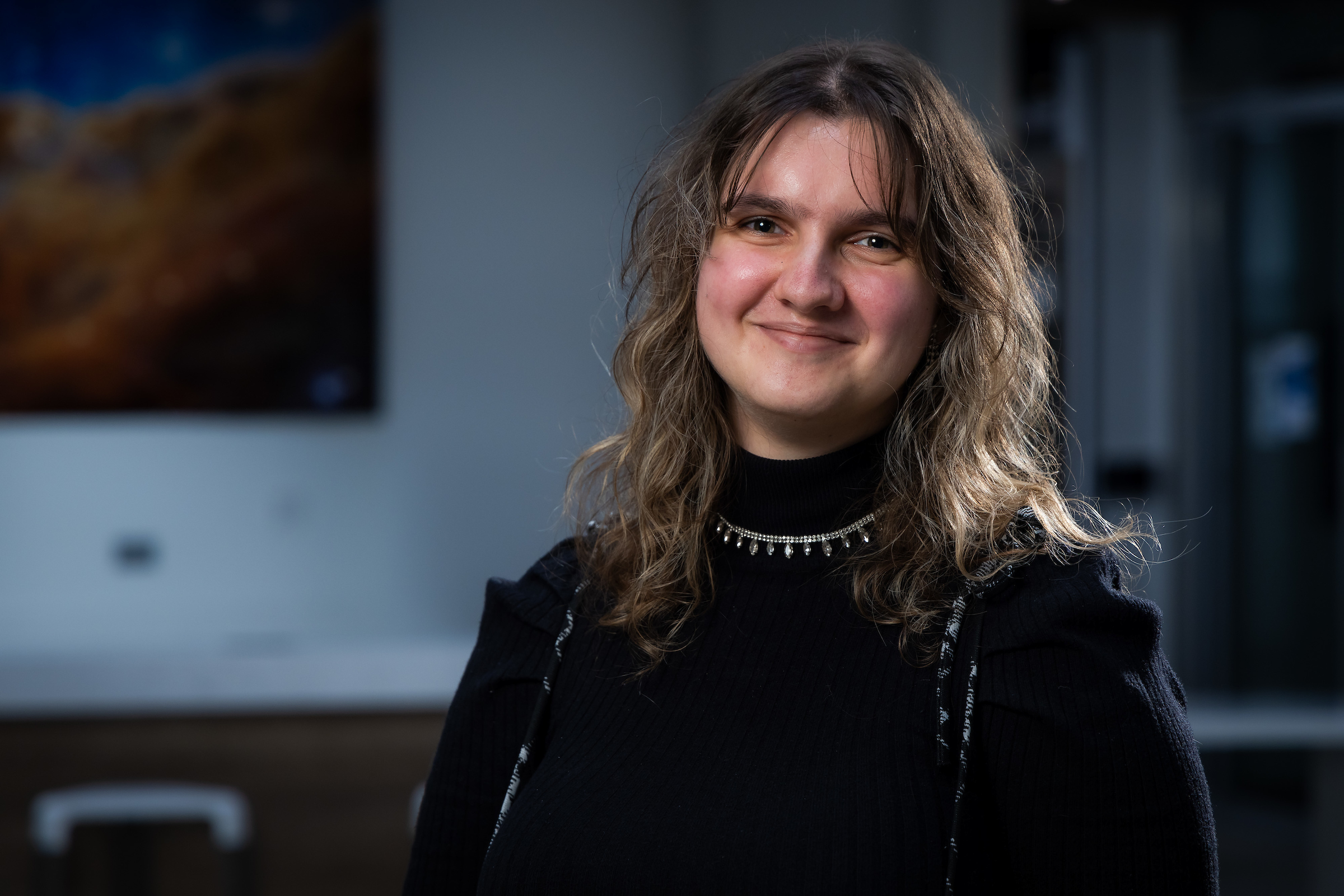Woman with long hair and black clothing