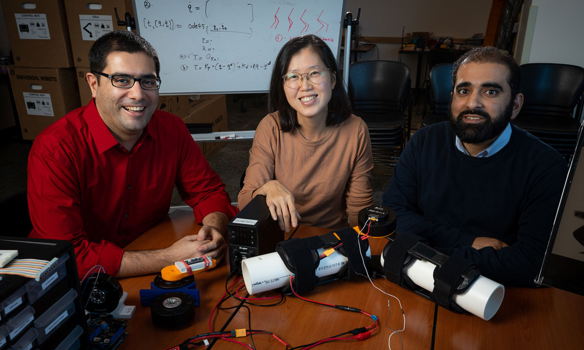 3 faculty around electronics