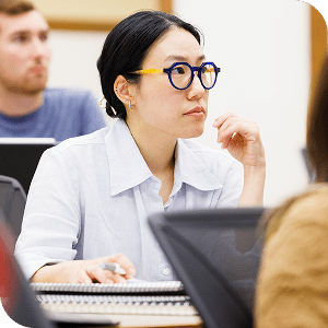 Female DePaul Law student in class