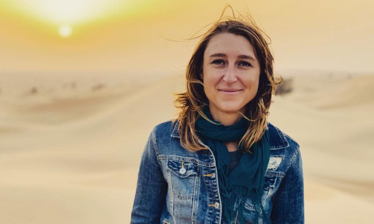 Female in the desert smiling