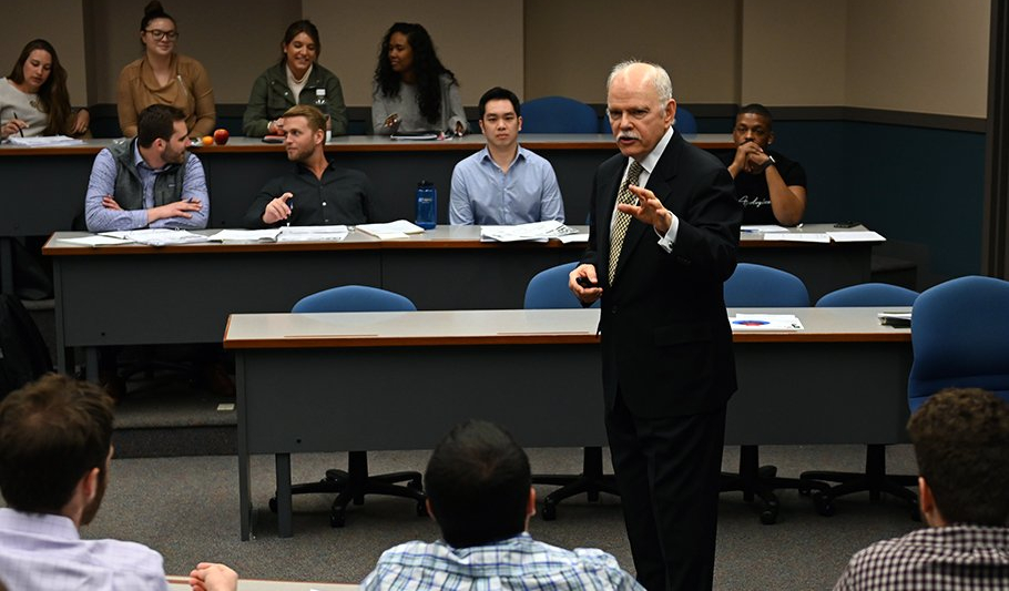 Business professor speaking to class