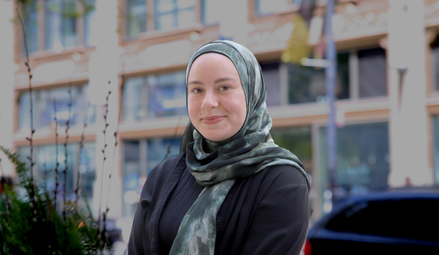 Esma Tantawi sits in front of DePaul Center in the Loop