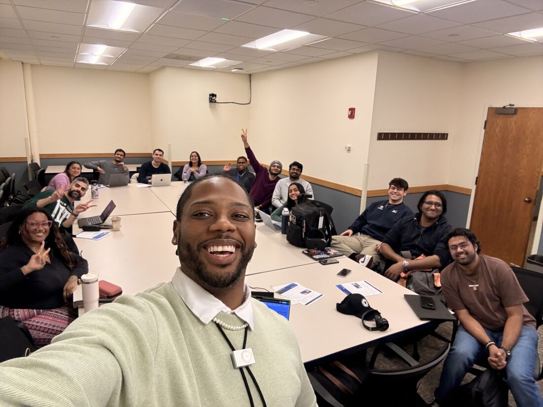 Professor and students taking a selfie