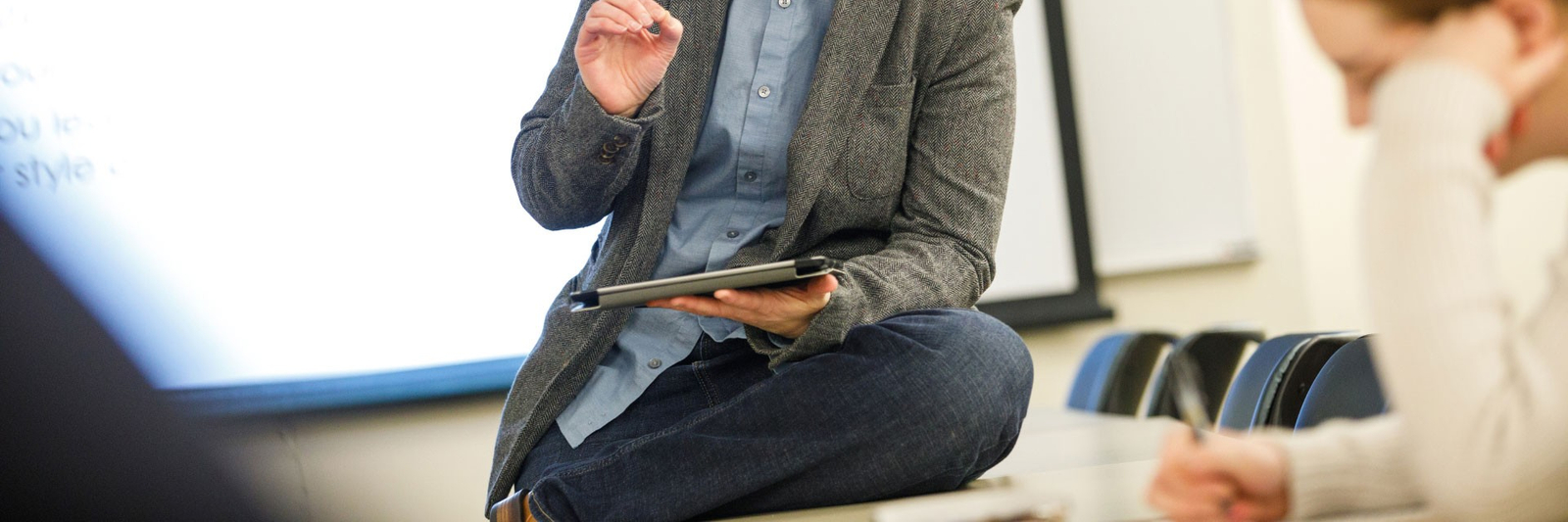 Focus on a professor speaking to a class