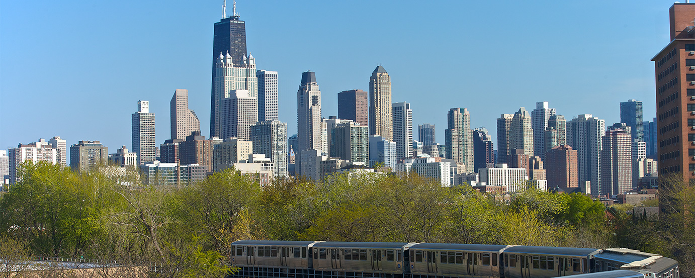 Chicago city skyline with L train in foreground