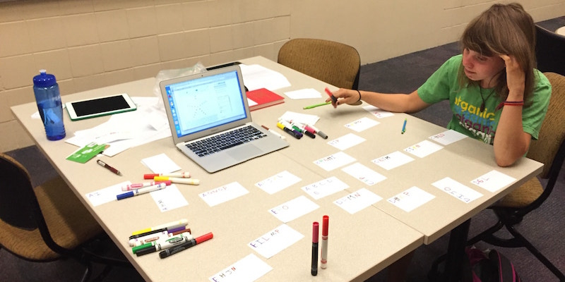 Student reviewing class material using note cards.