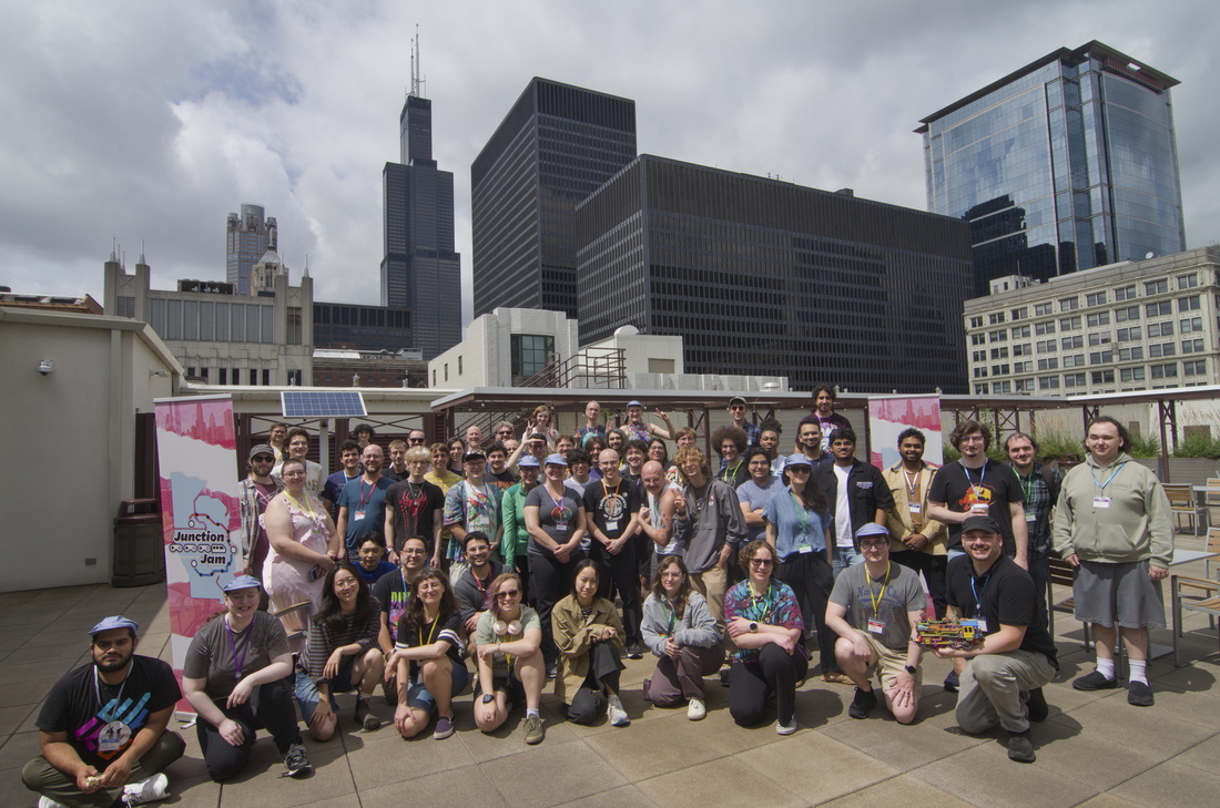 Large group of Junction Jam participants pose on DePaul rooftop 