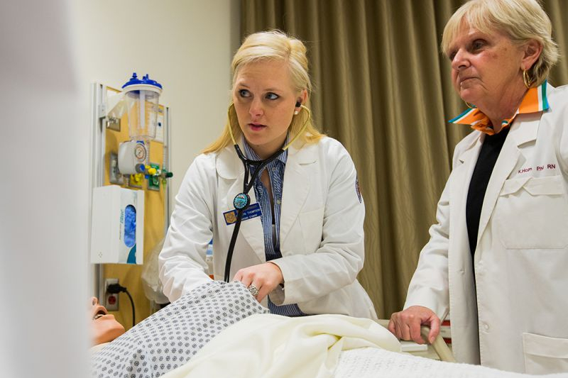 A student with a stethoscope.